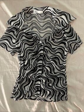 Lightweight zebra print button up top